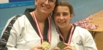 Mother and  daughter in the Tae Kwon Do medals