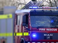 Firefighters tackle moorland car blaze