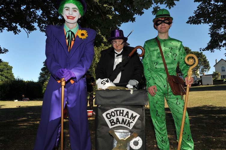 Photo: Steve Pope MDA090722H_SP003
Newton Abbot Carnival. Joker , Penguin and Riddler - also known as Paul, Jane and Jake Weatherhead from Dawlish