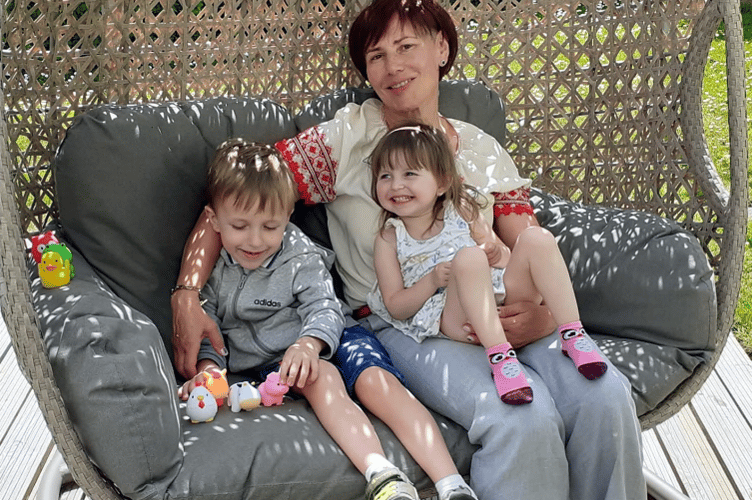 Ukrainian children Vladyslav, five, and Viktoriia safe in hte UK with their
grandmother.