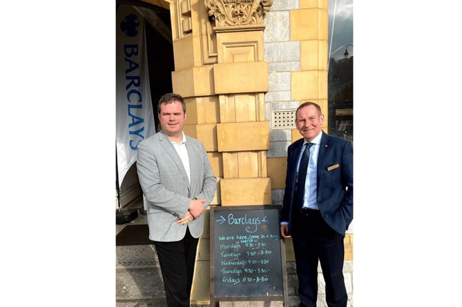 Mr Foster (left) is pictured with Barclays customer care director Michael Watts.