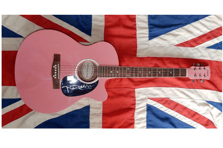 The guitar in question, signed by the Sex Pistols' Johnny Rotten