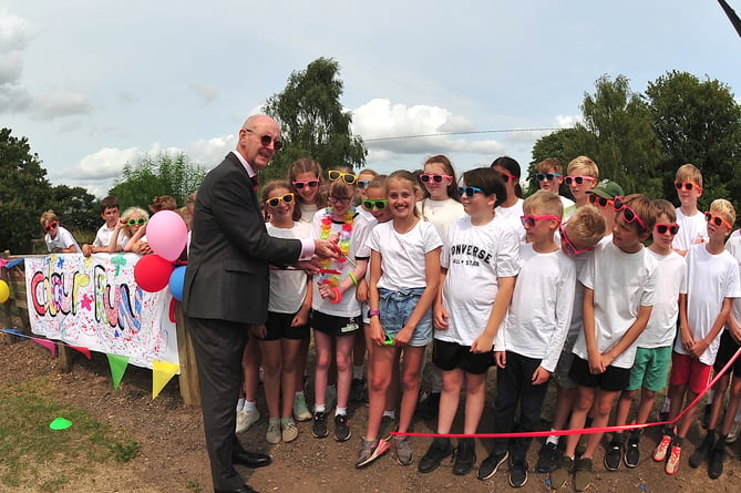 Photo: Steve Pope. MDA260623A_SP002
Lottie's charity colour run at Stover School. Sir Richard Ibbotson cuts the ribbon to get the run underway