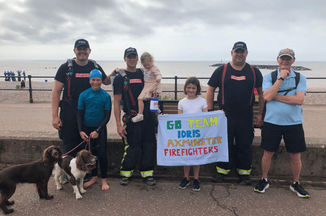 A TRIP BY THE SEA: Axminster firefighters arrive at Sidmouth as part of their 160 mile charity walk for youngster Idris