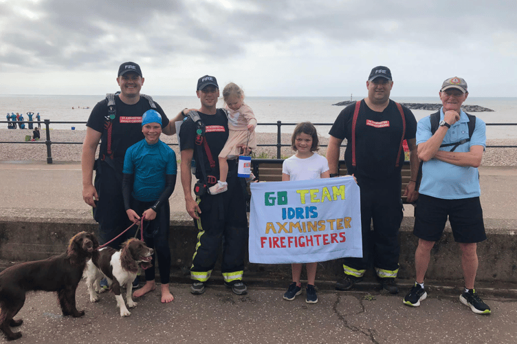 A TRIP BY THE SEA: Axminster firefighters arrive at Sidmouth as part of their 160 mile charity walk for youngster Idris