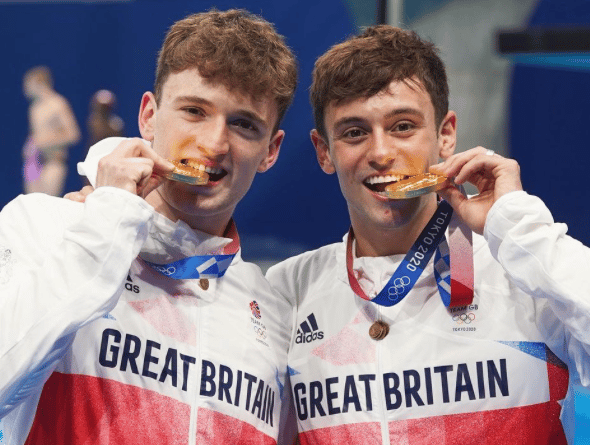 Tom Daley (right) with a gold medal