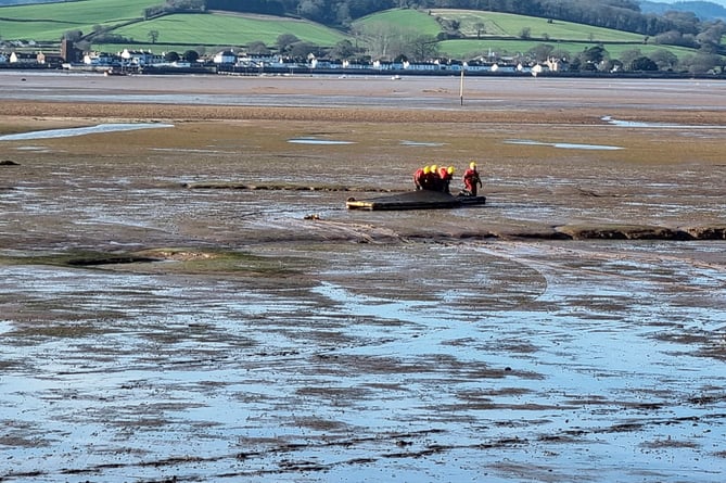 Firecrews come to the rescue of a person trapped in mud in the River Exe estuary