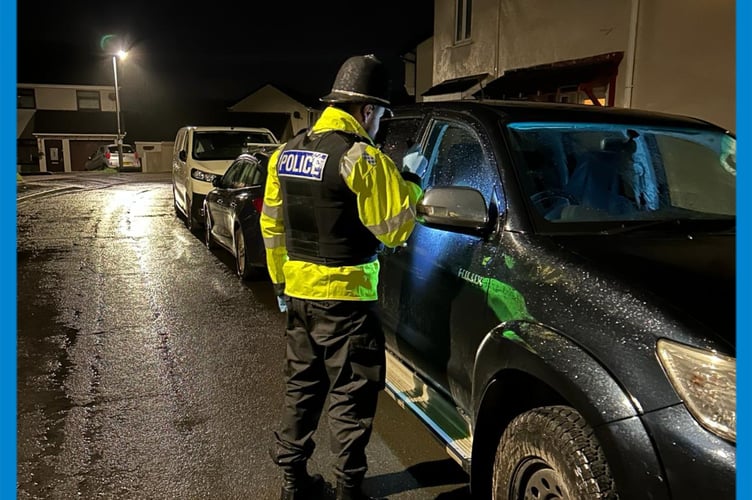 Officers checking cars in Kingsteignton 