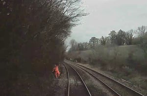 Rail worker in 'near miss' with train