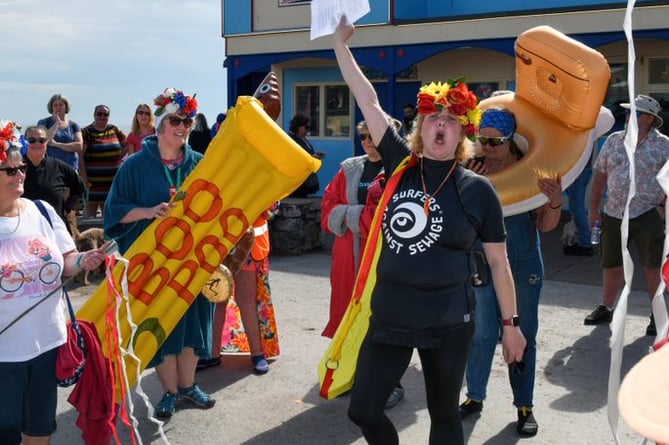 Peta Powell leads the protest against sewage pollution in Teignmouth