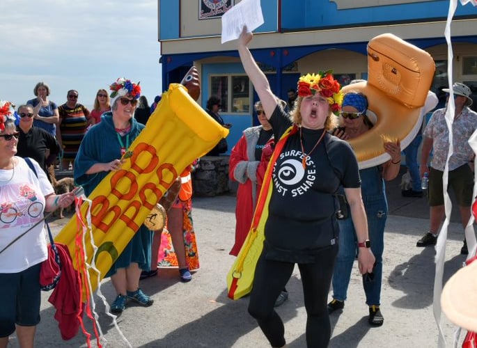 Peta Powell leads the protest against sewage pollution in Teignmouth