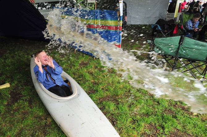 Kingsteignton Ram Roast Fair. Soak a Scout - Ellis Mackenzie of Kingsteignton Scout Group braves a bucket of water to raise funds
