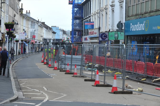 Here upon these stones, We will build our barricade. Fencing goes up in Newton Abbot's Queen Street as the controversial improvement plans get underway