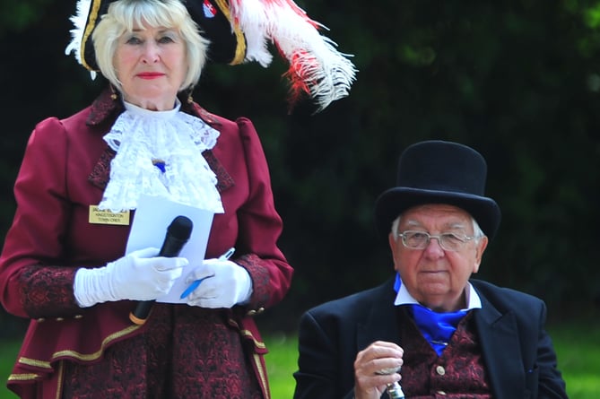 The inaugrual  Kingsteignton Town Crier Competition. Kingsteignton Crier Jackie Edward and consort John Hart. Competition rules dictate that the home crier can not participate but can instead perform the Benchmark Cry