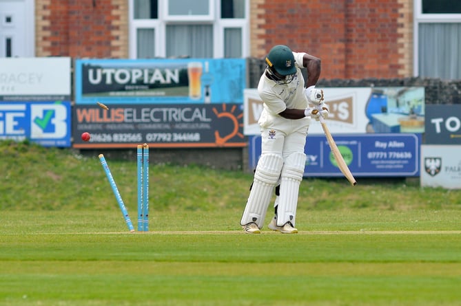 Devon Cricket League Premier Division.  Bovey Tracey versus Sandford. Bovey's Musa Twala loses his wicket to Matt Jeacock