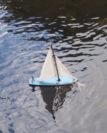 Toy boat on the water