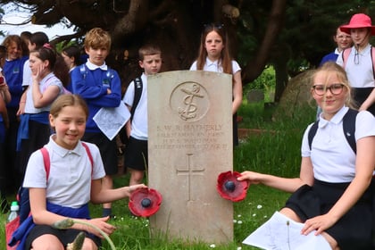 Children pay respects at war graves on D-Day anniversary 