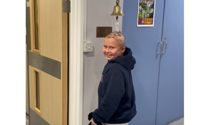 Francesca Walder ringing the bell at the end of her cancer treatment 