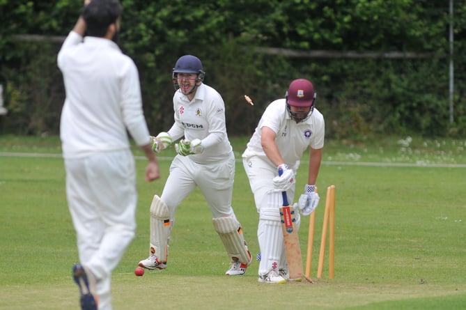 Devon Cricket League A Division. Abbotskerswell verus Torquay & Kingskerswell. A 98 run win for the visitors. Abbotskerswell 'keeper Ed Smout Cooper is delighted at Tim Western's wicket falls to Parminder Singh's bowling