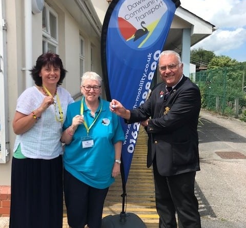 Sally Preston (office manager), Kathy Thornton (Admin volunteer) and Richard Hayward of Dawlish presenting the pin badges.