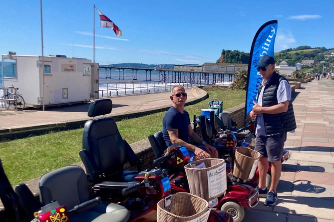 TeignMobility volunteers meet the coach trip from Somerset with seven mobility scooters