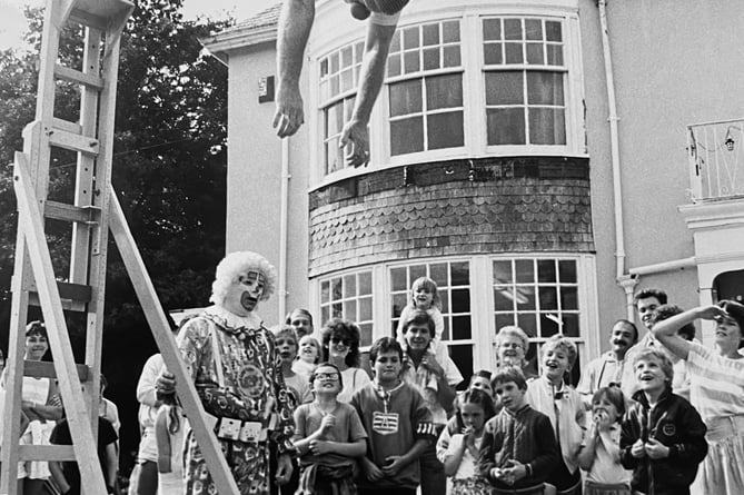 August 1987. Clown Richarrd Waldon attempting a British bath record dive attempt at Silverlands near Chudleigh