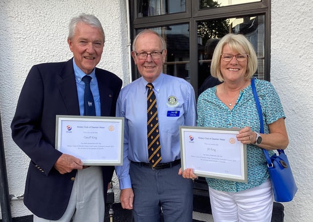 Community Champions Dawlsih Water Rotary. Geoff and Jill King receiving their awards from Dawlish Water Rotary Club President Chris May.