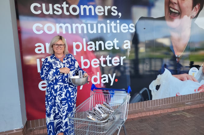 Highweek School administrator Tracy Lowe picks up supplies thanks to Tesco 