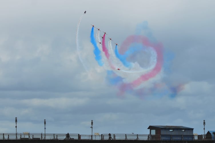 The Red Arrows roll in over Teignmouth Pier