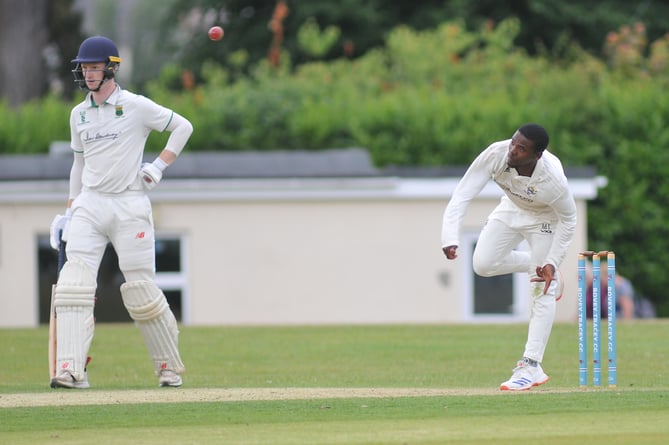 Devon Cricket League Premier  Division West. Bovey Tracey versus Cornwood.  Bovey's Musa Twala lets fly while Cornwood's Elliott Staddon watches and waits