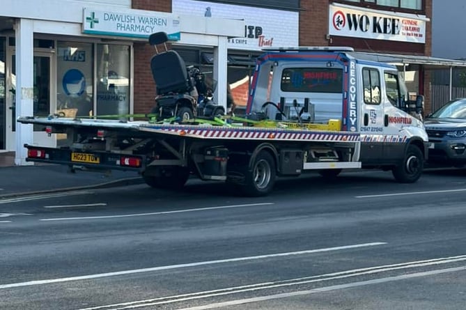 The damaged mobility scooter on a recovery truck at Dawlish Warren