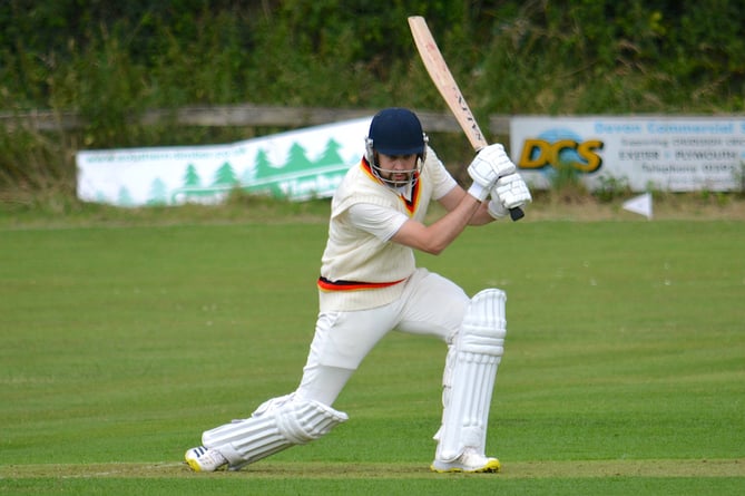 Chudleigh batsman Will Heather drives the Budleigh bowling through the off side