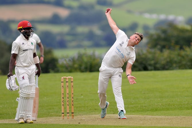 Devon Cricket League B  Division.Teignmouth and Shaldon versus Barton. T&S bowler Josh Couch prepares to send a ball down  watched by Barton's Tarisai Masakanda