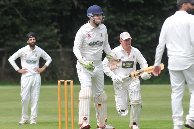 Devon Cricket League A Division. Abbotskerswell versus Tavistock. Tavi's Steve Luffman and Abbot's 'keeper Ed Smout-Cooper