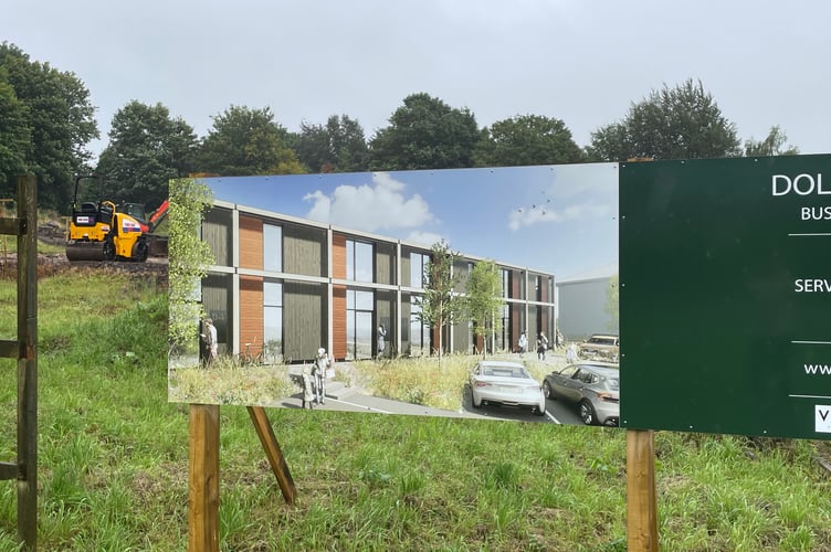 Diggers and sign at Dolbeare Meadow Ashburton