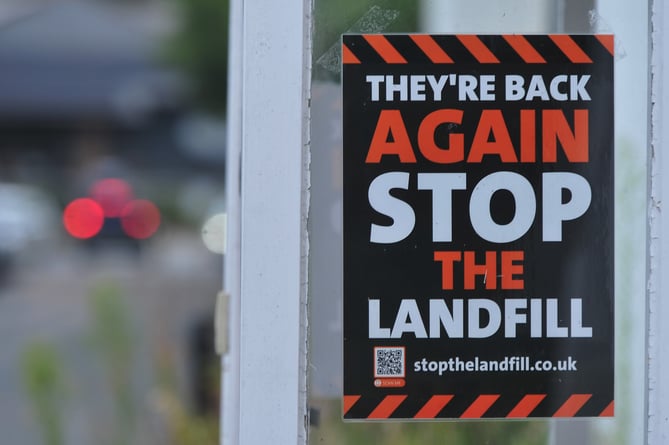 Landfill site proposal. Protest signs around Kennford