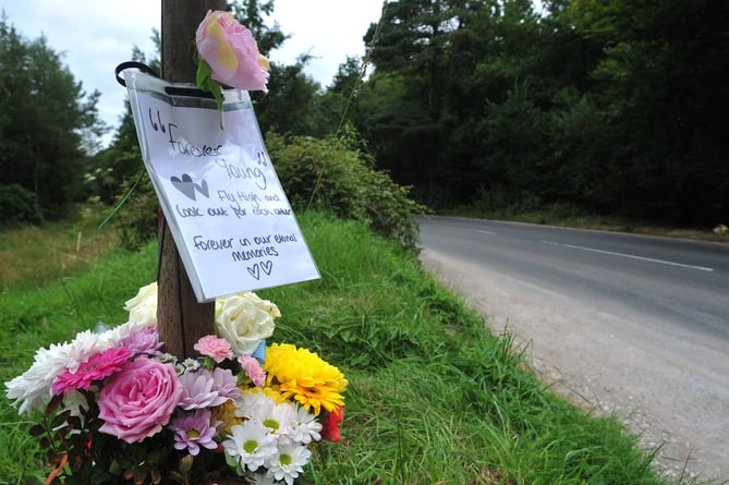 Floral tributes left at the site on the unclassfied road linking Haldon Hill and Telegraph Hill where two teenagers died  following a single vehicle RTC on August 8