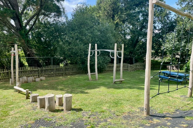 Adventure course with climbing frame and stepping stone logs at the Lawns play area in Bishopsteignton