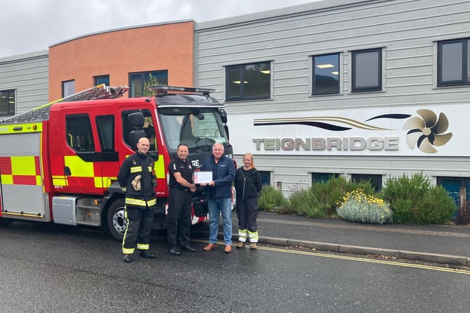 Devon and Somerset Fire and Rescue Service present a certificate of gratitude to Teignbridge Propellers Ltd L-R Dan Harrity, Scott Leanam, Mark Phare and Charlie Plyer