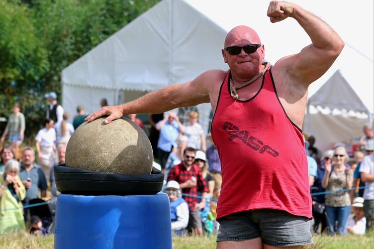 The Mighty Smith strongman show in the main ring at the Lustleigh Show