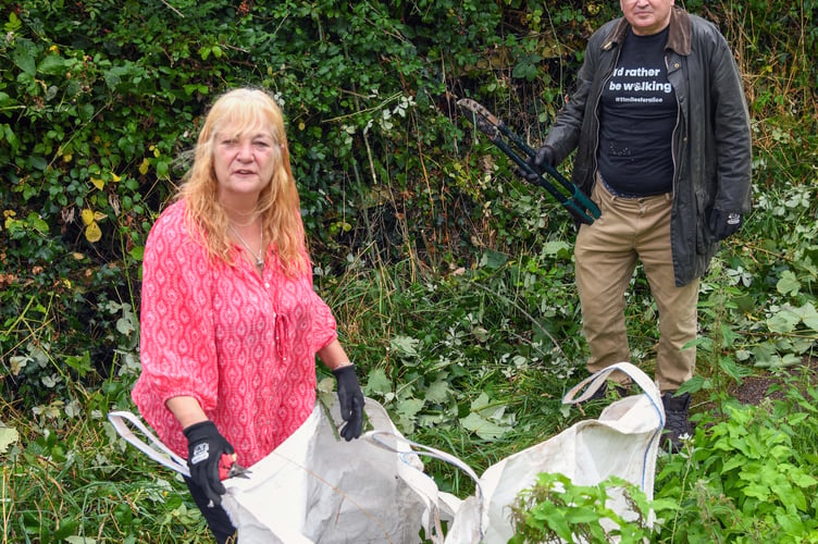 L-R Councillors Penny Lloyd and David Cox hope to turn the overgrown area between Teignmouth's Third Avenue and Fourth Avenue into a pocket park