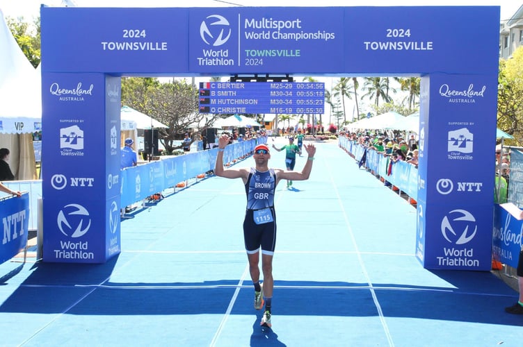 David Brown crossing the finish line in Townsville