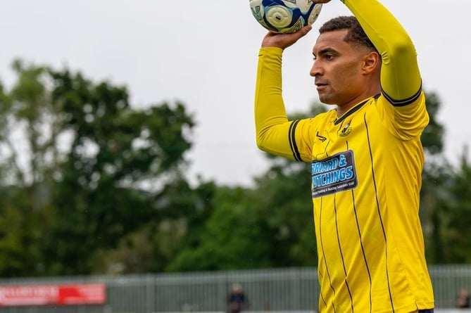 Myles James preparing to take a throw-in for Buckland