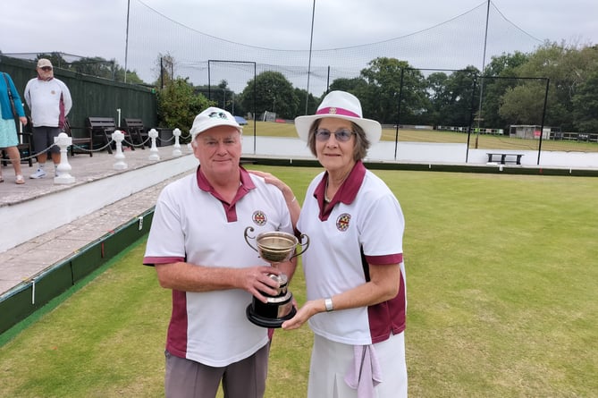 Chudleigh Bowls' ladies club champion Margie Wilson is presented with her trophy