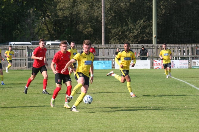 Ryan Bush with the ball at his feet