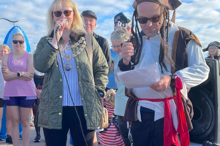 Teignmouth Mayor Cate Williams and Teignmouth Promenade parkrun event director Paul Burgess at the event's 6th anniversary pirate run