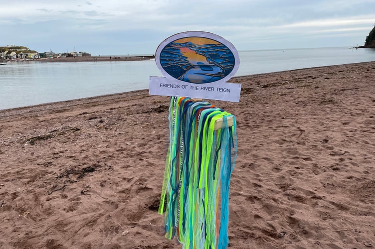 Friends of the River Teign signage on Shaldon beach.