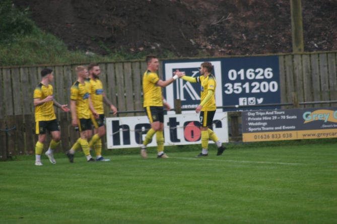 Ryan Bush celebrates his opener against Brixham