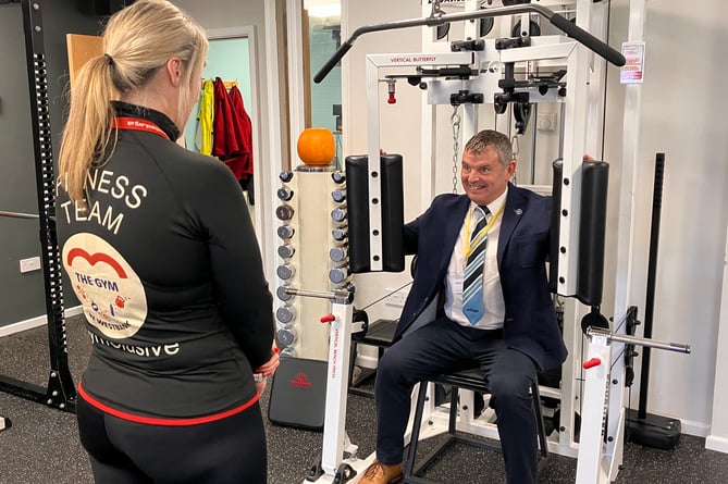 Westbank - ECF trustee David Bird tries out the Equalizer under the instruction of Westbank gym manager Natasha Willis (Photo by Sharon Goble)