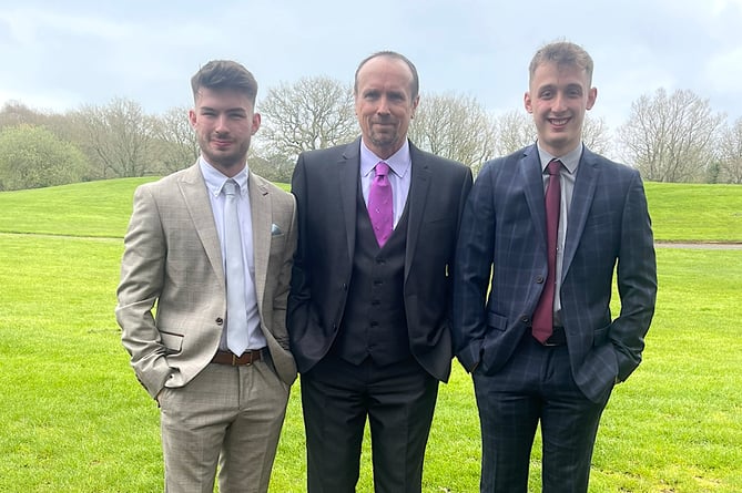 Paul Holmes (centre) with step-sons Ben (left) and Jake (right)